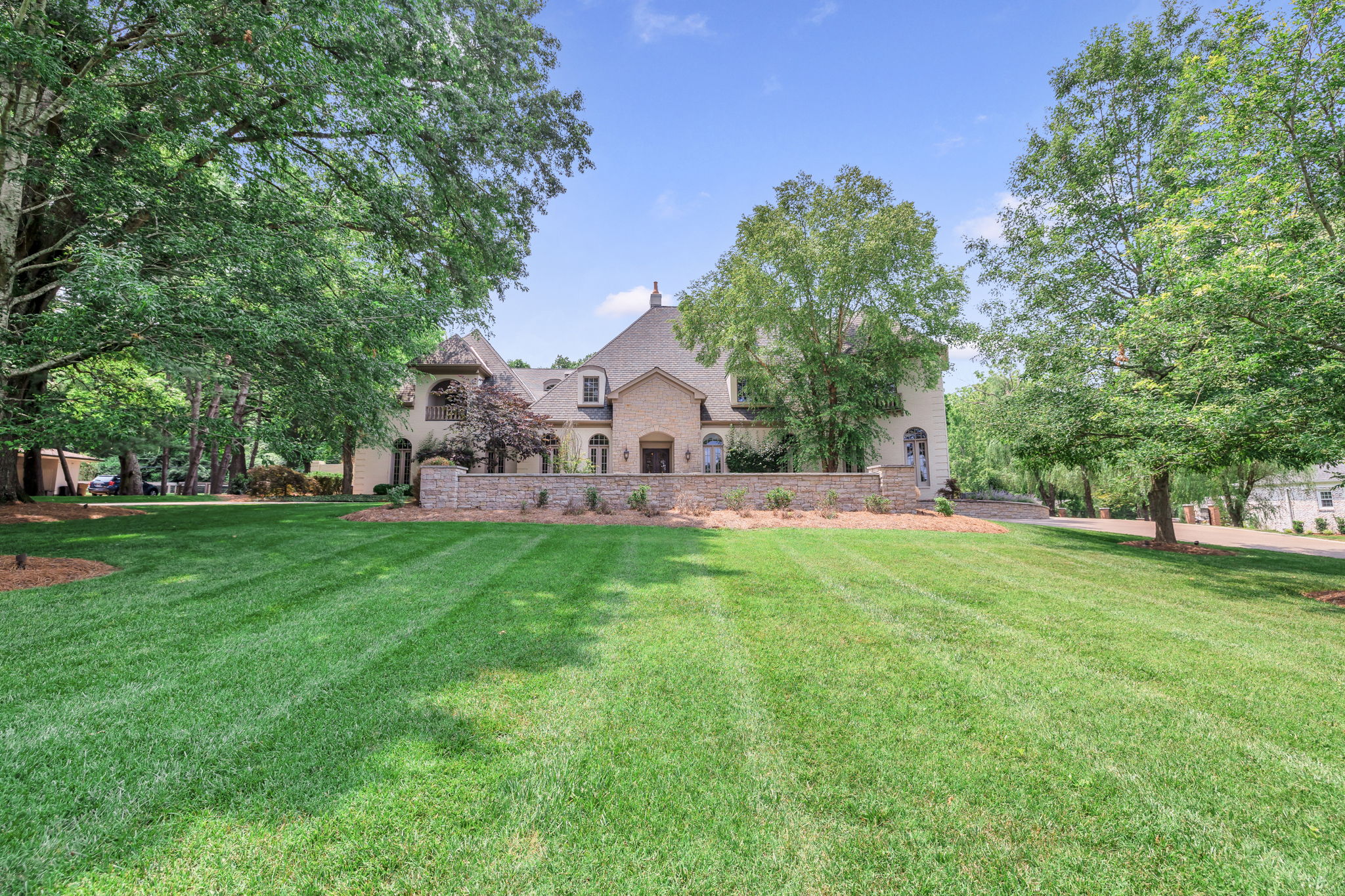 View the large, landscaped yard of Nashville's Prestigious Hillwood Estates on 1.2 acres.